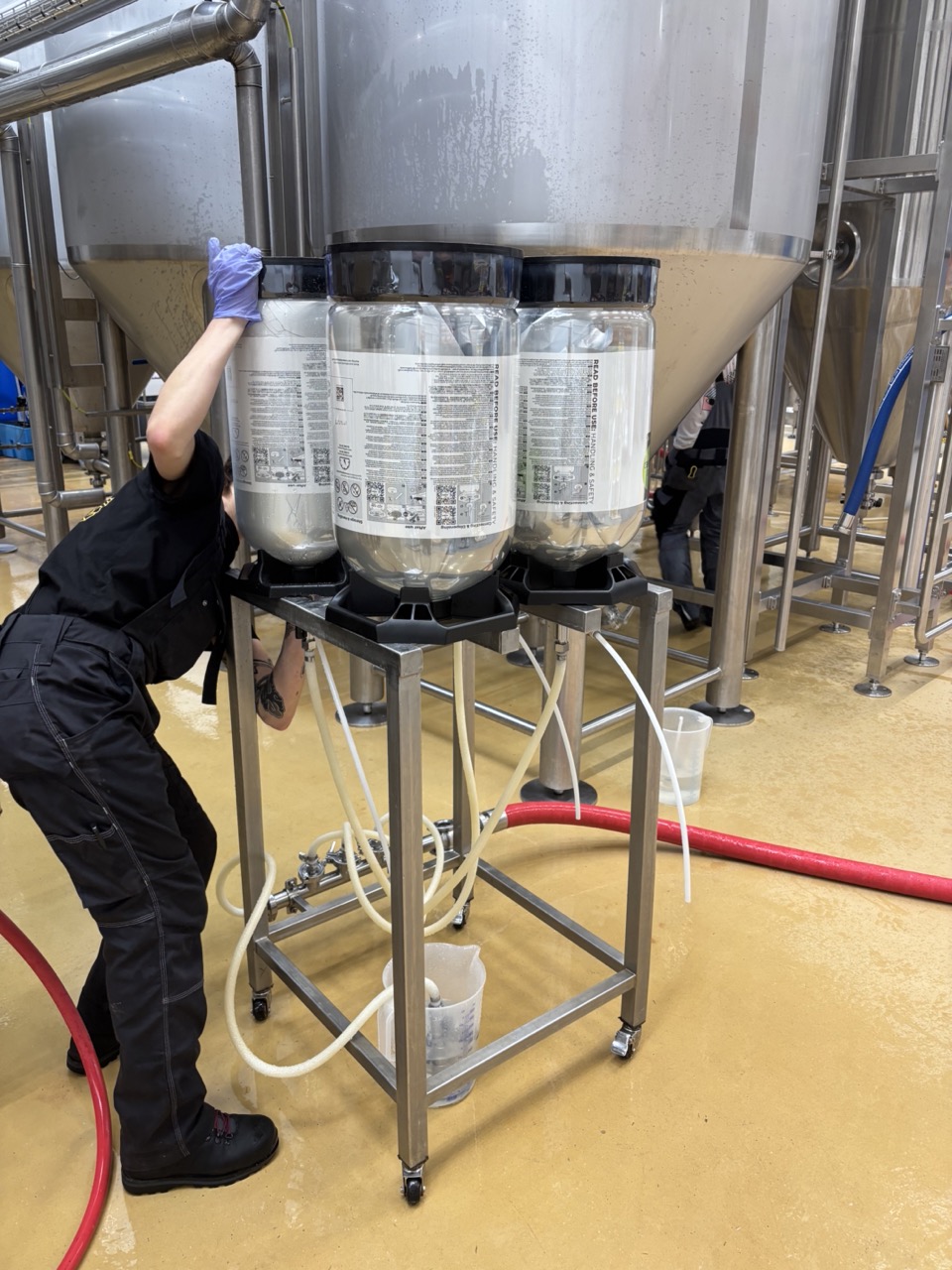 Four KeyKegs filling upside down on the filling station