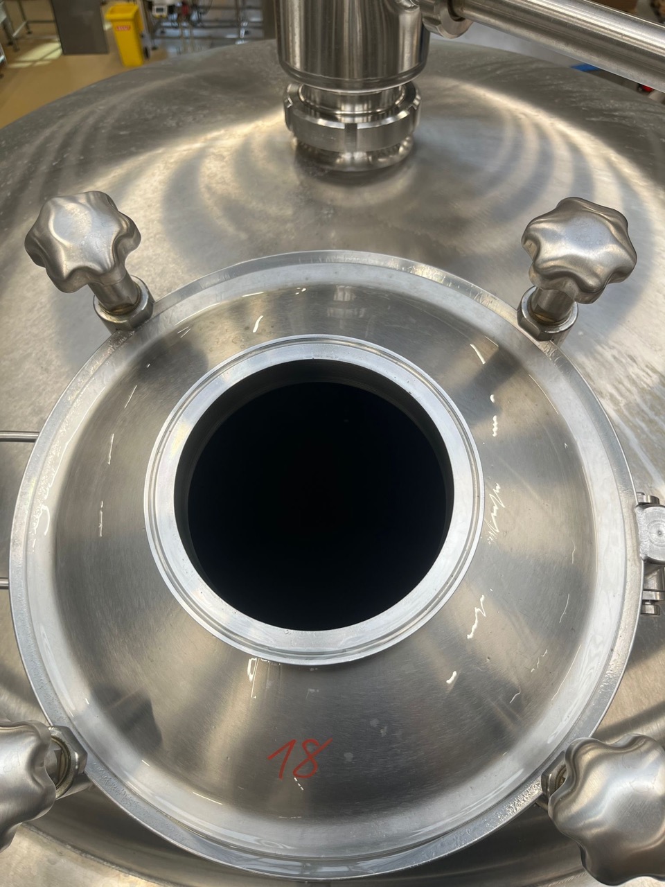 Dry hop port open on a new tank — ready for hop addition
